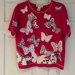 Pink, black and white sweater with butterfly appliqués perfect for spring.